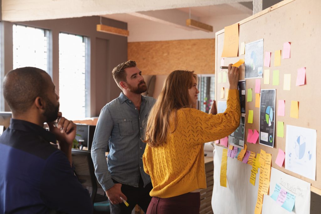 Young creative professionals working in a sunlit office